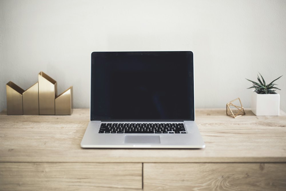 A laptop on a wooden desk